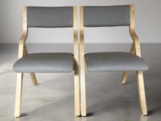 A pair of modern laminated bentwood adjustable folding chairs.