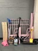 A child's metal framed bed, a scooter, bird house and seed, etc.