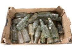 A collection of antique glass bottles.