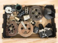 A group of antique wooden fishing reels, a Chinon CX camera, trophy cups, etc.