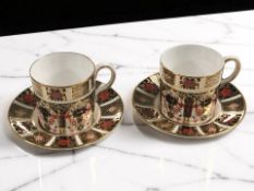 A pair of Royal Crown Derby Old Imari porcelain coffee cans and saucers, pattern 1128, saucers 11.