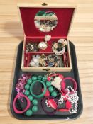 A jewellery box containing assorted costume jewellery, cameo brooch, bangles, etc.