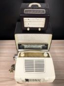 An Ekco bakelite cased valve radio, width 35 cm, and two further radios.