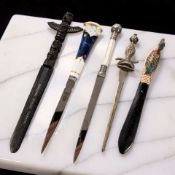 A group of decorative letter knives.