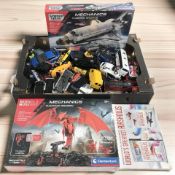 A collection of die cast cars and two science museum modelling kits (still sealed in cellophane,