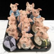 A group of Wade Natwest pigs and a further Poul Willumsen Danish plastic piggy bank.