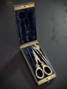 A fine quality high carat gold enamel part-sewing set in fitted ebony case.