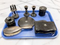 A group of ebony dressing table items.
