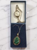 A lady's 9ct gold Accurist wristwatch on gold strap (a/f) and a polished malachite pendant stamped