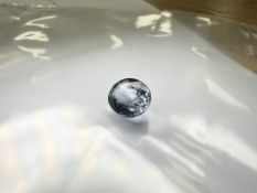 A loose oval-cut light blue tanzanite weighing approximately 3.