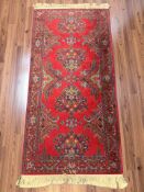 A machine-made eastern rug,