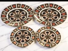 A pair of Royal Crown Derby Imari porcelain dinner plates, pattern 1128,