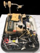 A Shimano Aero XT-7 2000X fishing reel, other fishing equipment, several pairs of scissors, clamps,