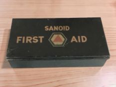 A Sanoid first aid tin and contents.