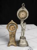 Two antique figural mantel clocks, tallest 32 cm.