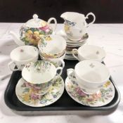A twenty one piece Rob Turner bone china tea service with floral decoration.
