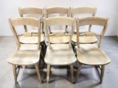 A set of six pine dining chairs.
