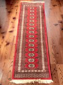 A Lahore Bokhara runner, Pakistan, 191 cm x 64 cm.