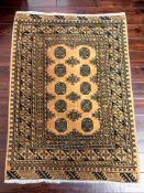 An Afghan gold Turkoman rug, 144 cm x 102 cm.