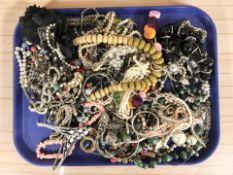 A collection of costume jewellery, simulated pearls, bangles, etc.