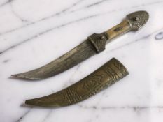 An eastern curved knife in brass scabbard, blade 13.5 cm.