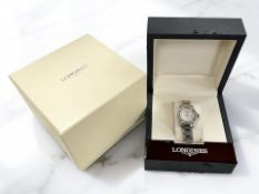 A lady's stainless steel Longines Conquest quartz calendar wristwatch with diamond set bezel and