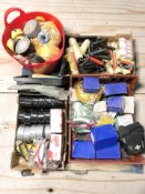 Assorted rolls of tape, paint rollers, screws and other hardware.