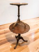 A reproduction mahogany pie crust edge tripod occasional table, diameter 60 cm,