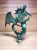 A contemporary enameled metal figure of a dragon, height 75 cm.