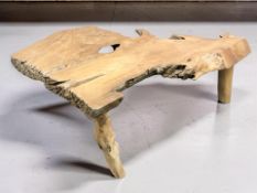 A rustic burr wood tripod coffee table, width 142 cm.