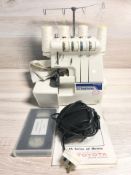 A Toyota SL 3477 3/4 thread overlocker sewing machine, with lead and pedal.