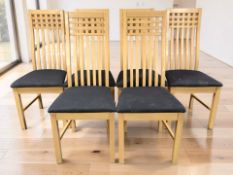 A set of six contemporary high backed dining chairs.