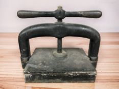 A Victorian cast iron book press, width 41 cm.
