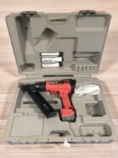 A Flex Bammer nail gun, in case, with related components. Together with a golf club.