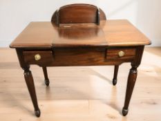 A reproduction mahogany dressing table, 92 cm x 52 cm x 89 cm.