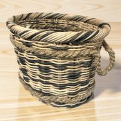 A rope and wicker twin handled log basket, width 50 cm.