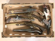 A group of ornamental flintlock pistols, German Luger, etc.