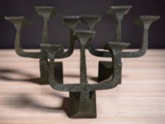 Three metal three branch pricket candlestick wall brackets, each 40 cm wide.