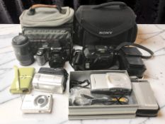 A Minolta Maxxum 5000I camera, further cameras including Olympus and Sony, attachments, camera bags,