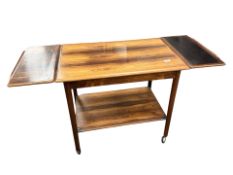 A Danish mid-century Brazilian rosewood (Dalbergia Nigra) two-tier trolley, with extension leaves,