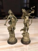 A pair of gilt spelter figures of semi-nude ladies, height 41 cm.