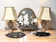 A gilt framed mirror, pair of wooden table lamps, scale model of HMS Endeavour,