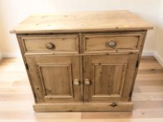 A modern pine sideboard fitted two drawers and cupboards, 92 cm x 50 cm x 82 cm.