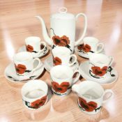 Fourteen pieces of Wedgwood Cornpoppy coffee china designed by Susie Cooper.