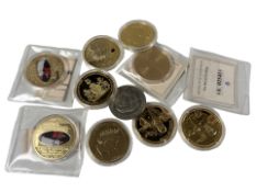A group of gold plated commemorative coins.