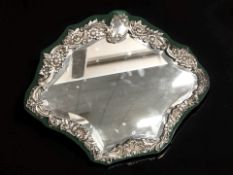 An Edward VII embossed silver easel mirror, Sheffield marks 1903, width 36 cm.