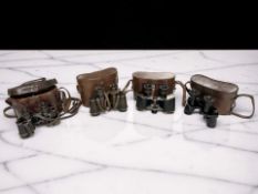 Four antique pairs of binoculars including a pair of Ross London binocular prismatic binoculars