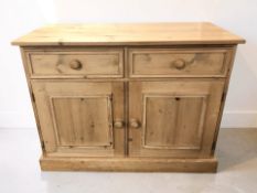 A modern pine sideboard fitted two drawers and cupboards, 107 cm x 50 cm x 82 cm.