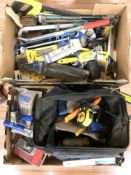 A tool bag and various hand tools, hardware.