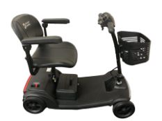 A Discover Mobility electric scooter, with key and charging lead.